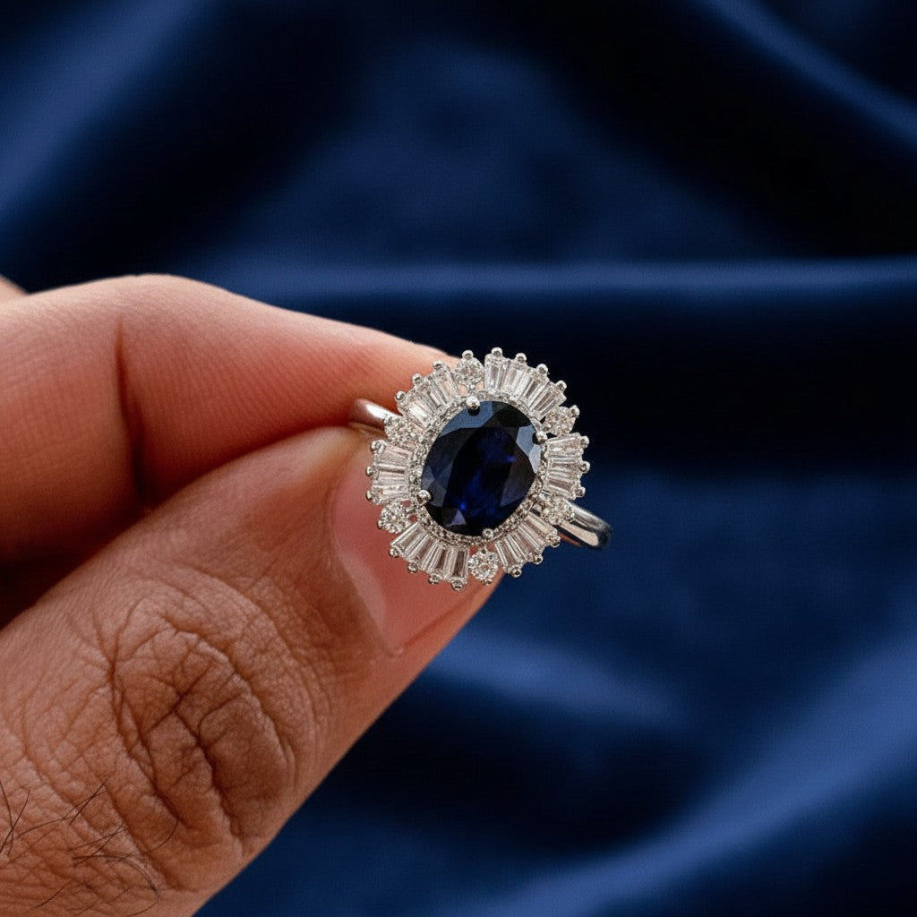 SilverStones.Pk oval blue sapphire ring with halo of baguette-cut white stones, crafted in 925 sterling silver.