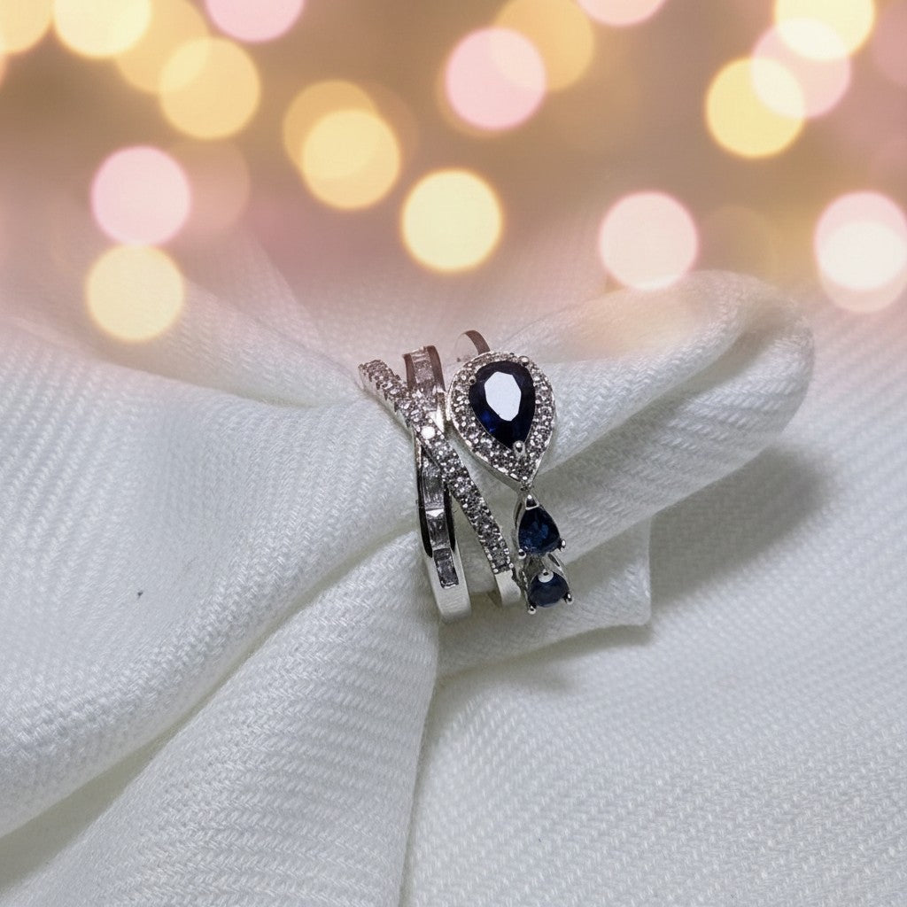 SilverStones.Pk luxury ladies ring set with pear-cut blue zircon and baguette stones. Silver-tone metal.