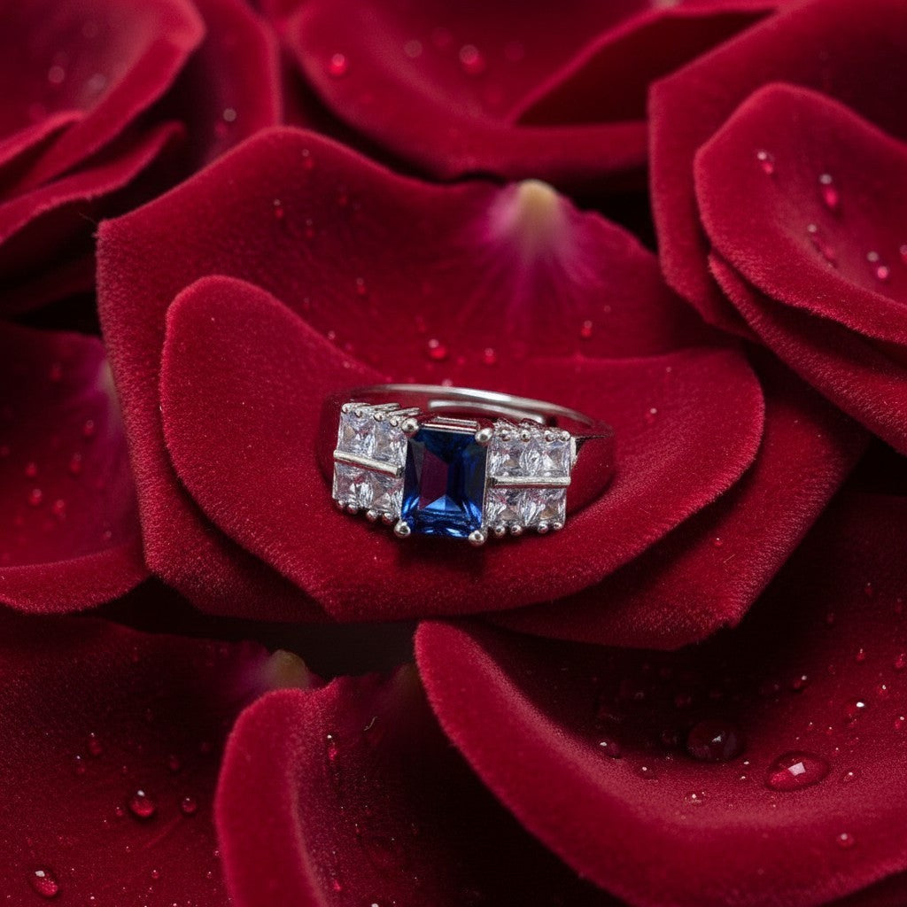 SilverStones.Pk elegant ladies ring with a central square blue zircon and surrounding clear square zircon stones.