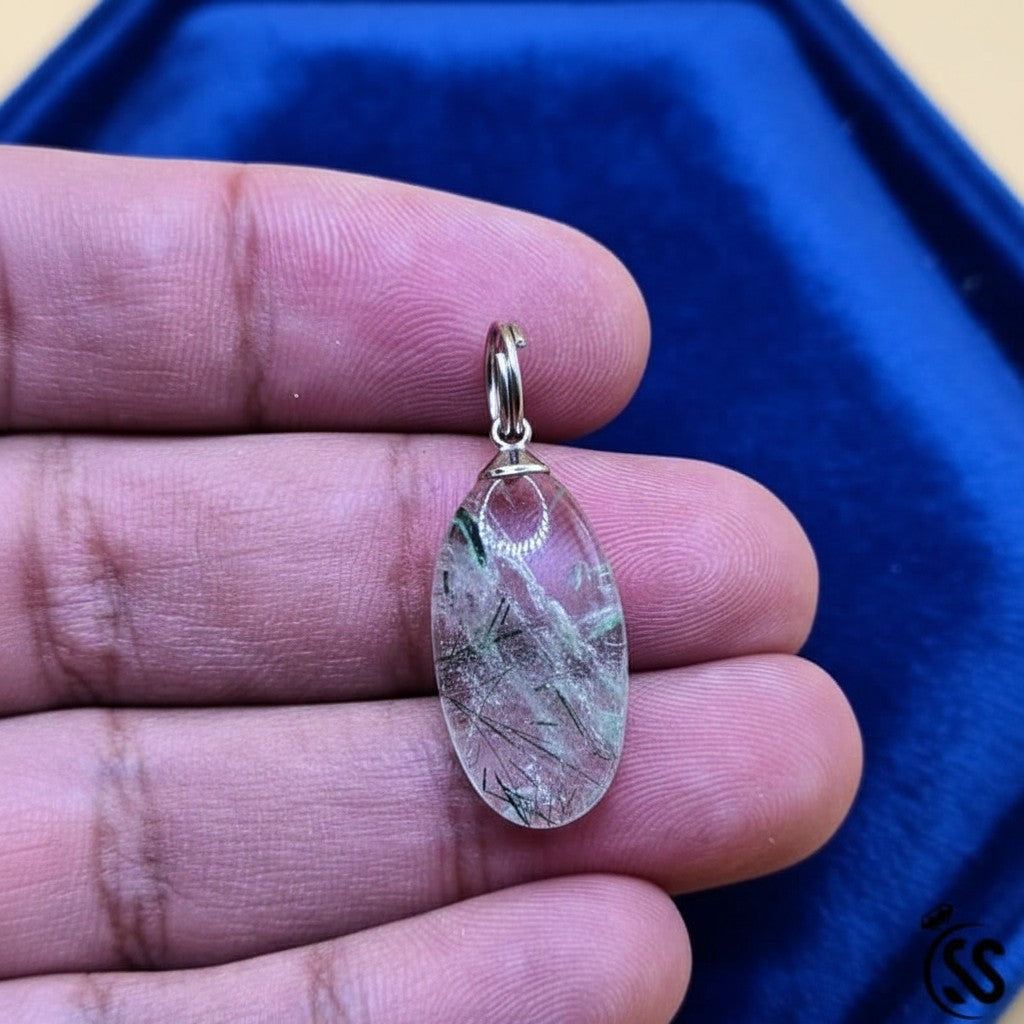 SilverStones.Pk clear quartz pendant with black inclusions, oval shape, metal hook, unisex spiritual jewelry.