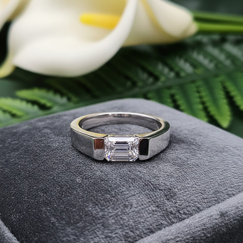 SilverStones.Pk men's pure silver ring with a central emerald-cut Moissanite diamond, set in a channel.