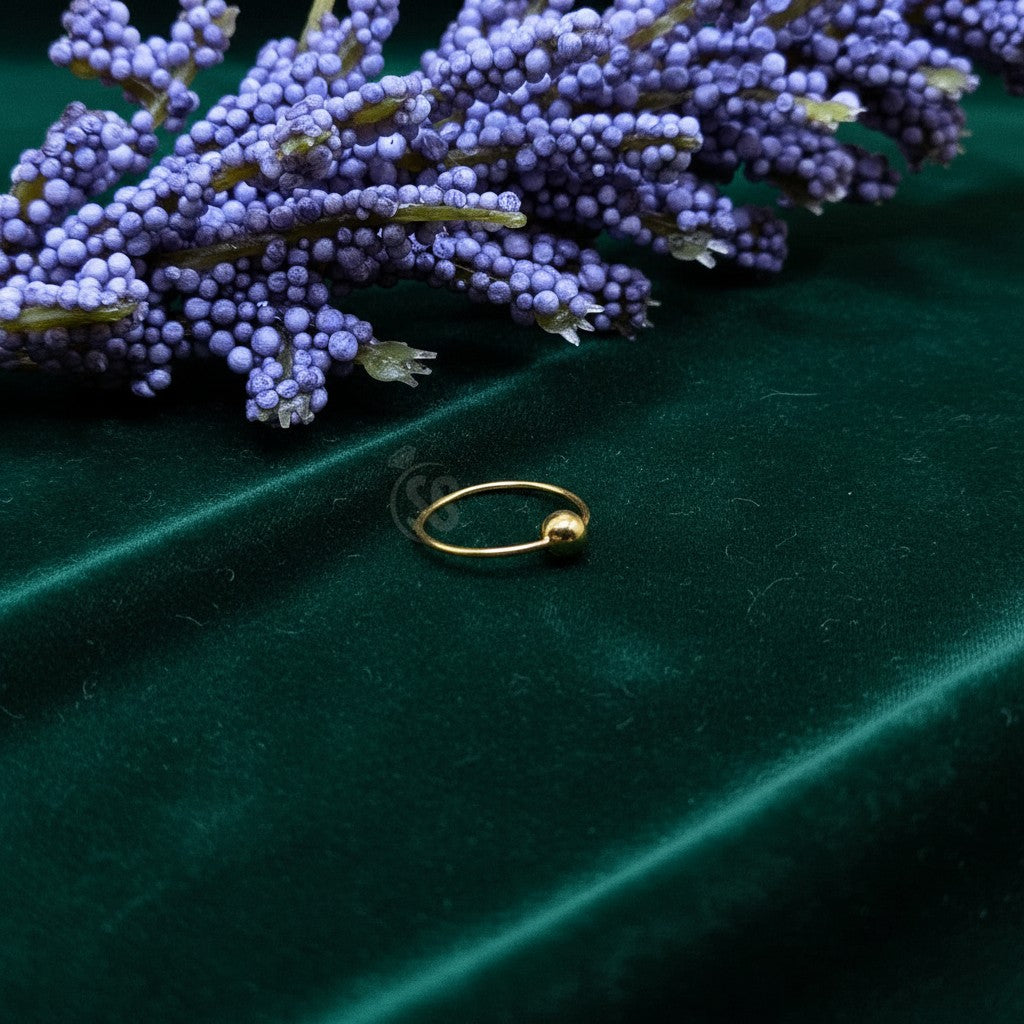 SilverStones.Pk 10mm 24-carat gold-plated sterling silver nose ring with a small ball accent.