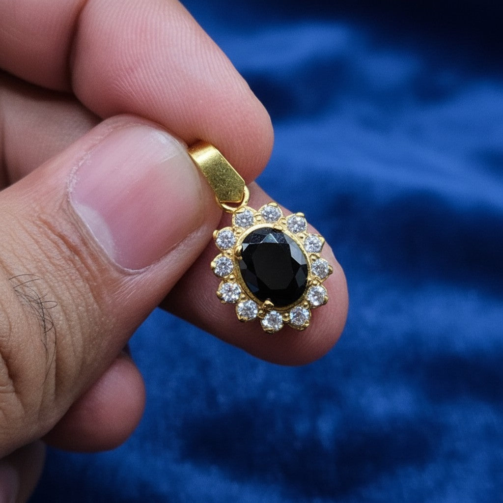 SilverStones.Pk 925 sterling silver pendant with 24K gold plating, featuring a black oval center stone surrounded by clear zircon stones.