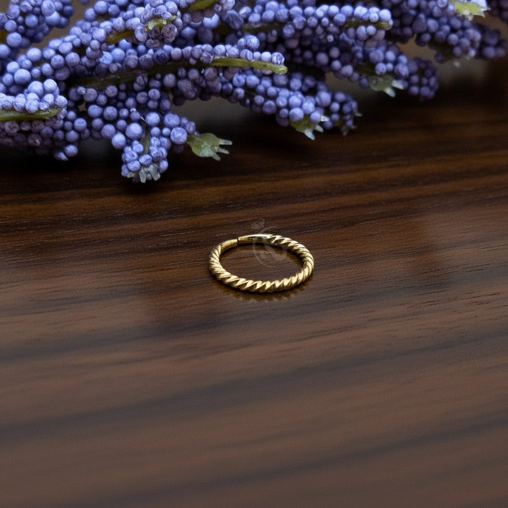 SilverStones.Pk 8mm 24k gold plated sterling silver twisted nose ring. Hypoallergenic and elegant.