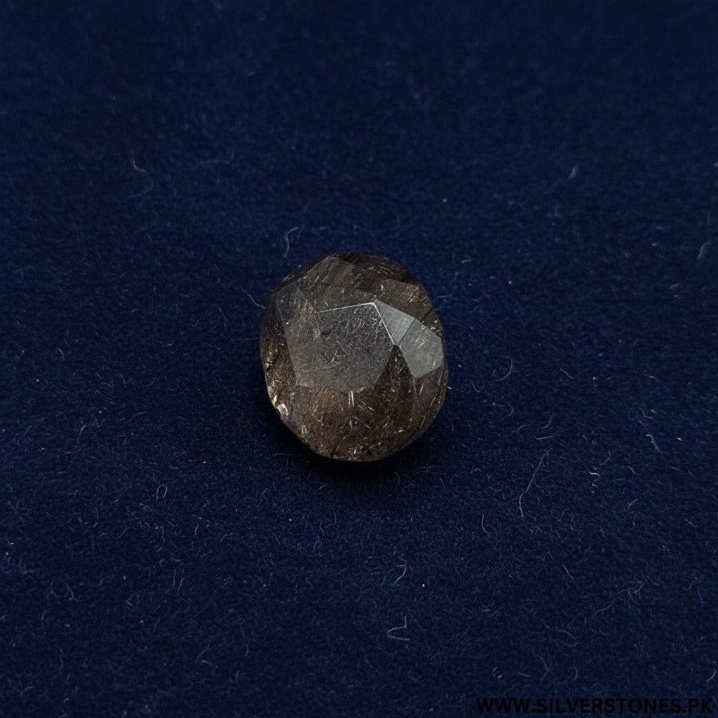 SilverStones.Pk Golden Muh-e-Najaf stone, a rare 12.48 carat gemstone with unique golden inclusions and faceted cut.