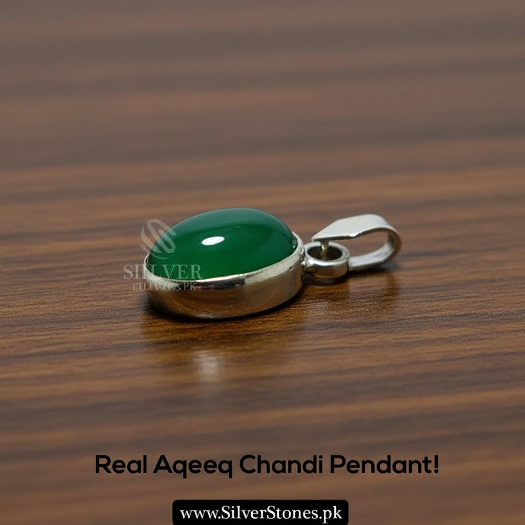 SilverStones.Pk oval green aqeeq gemstone set in a silver chandi pendant.