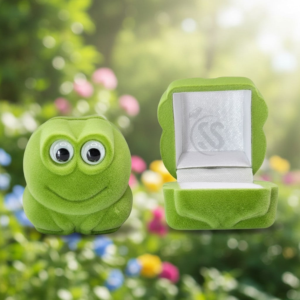 SilverStones.Pk green velvet frog ring box, open and closed views. Features googly eyes and a plush interior.
