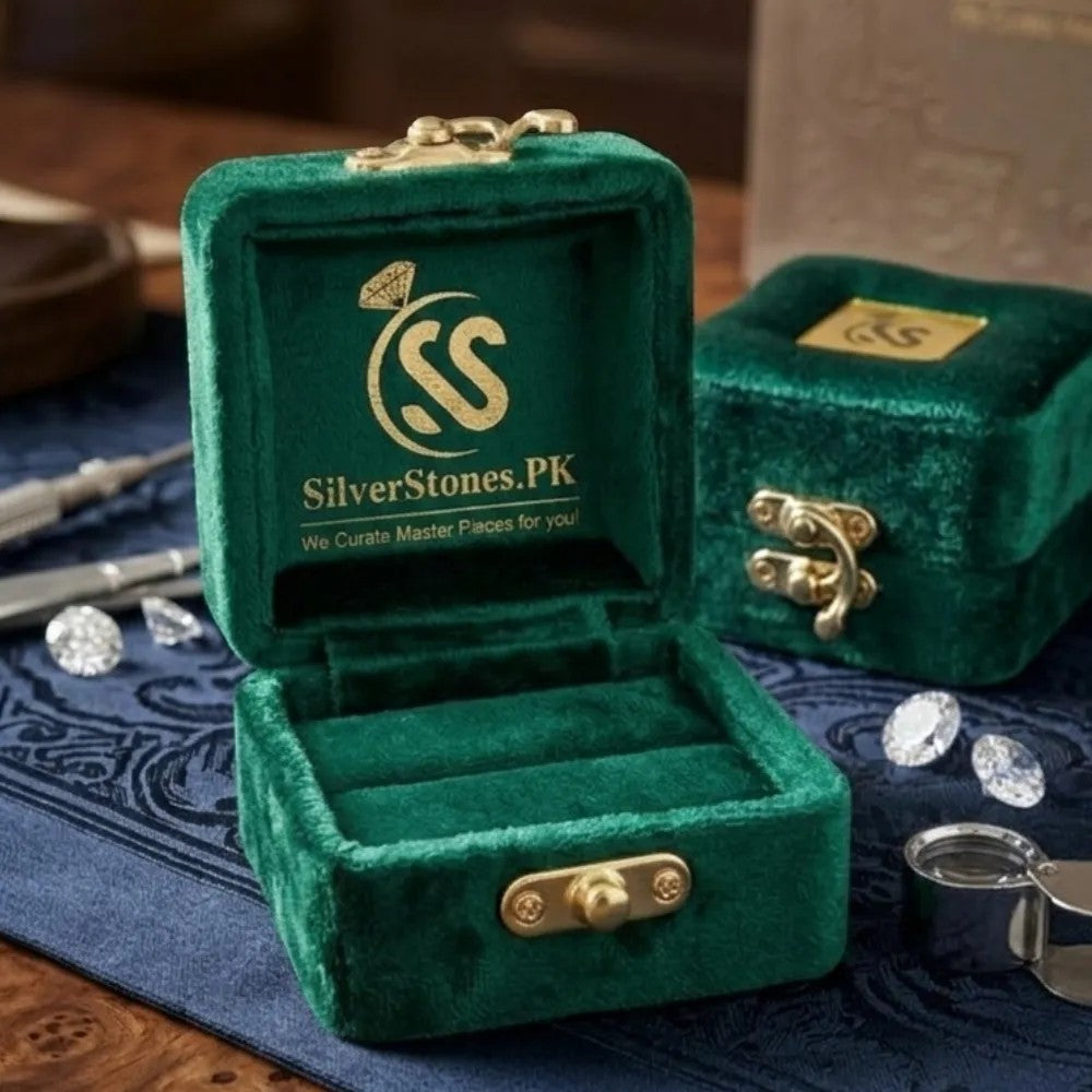 SilverStones.Pk green velvet ring box with gold clasp, showcasing diamonds and ring slots. Ideal for men's jewelry.