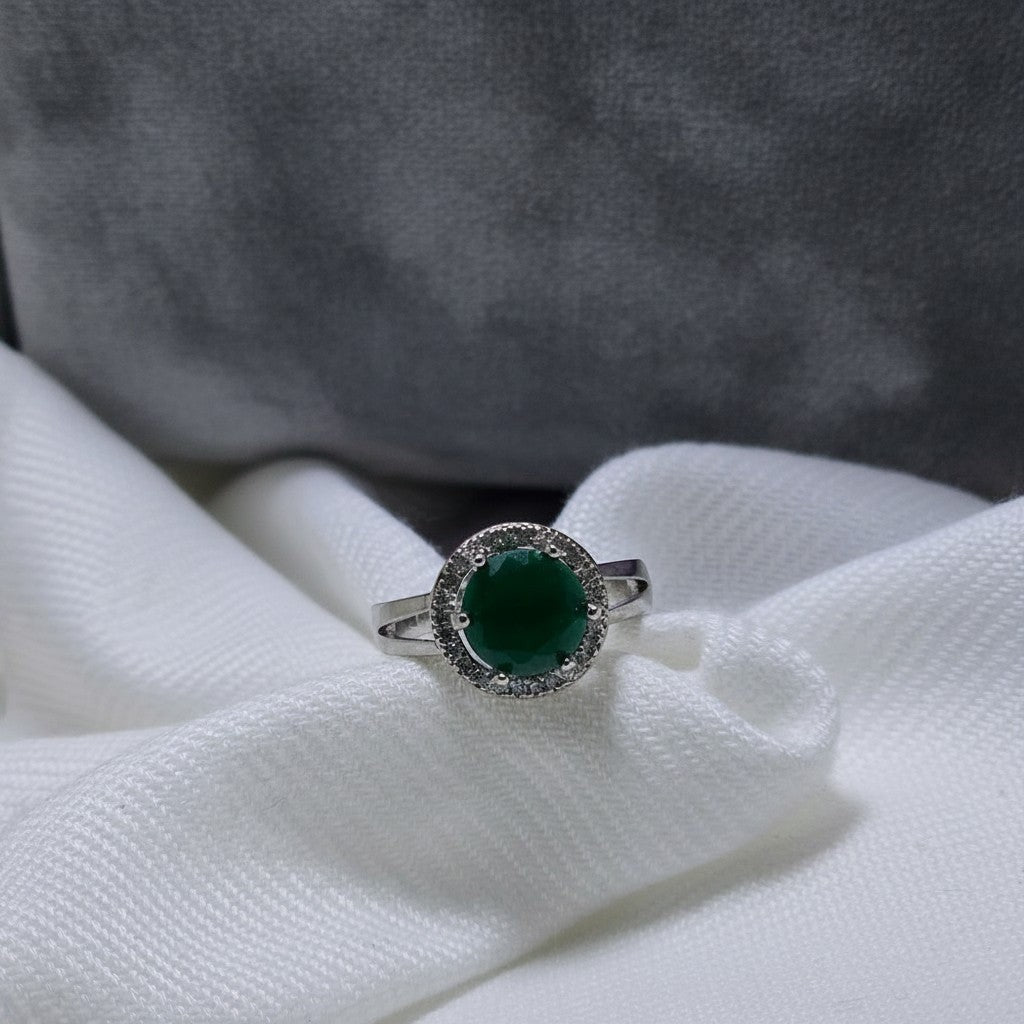SilverStones.Pk designer ladies ring with a large round green zircon stone surrounded by smaller clear zircon stones, set in silver.