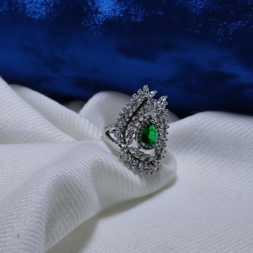 SilverStones.Pk designer ladies ring with a pear-cut green zircon and surrounding clear zircon stones, set in silver.
