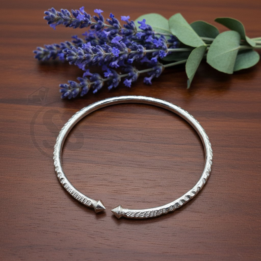 SilverStones.Pk handmade pure silver wrist band for kids, 1.5 inches, 9 grams, adjustable fit, elegant design.