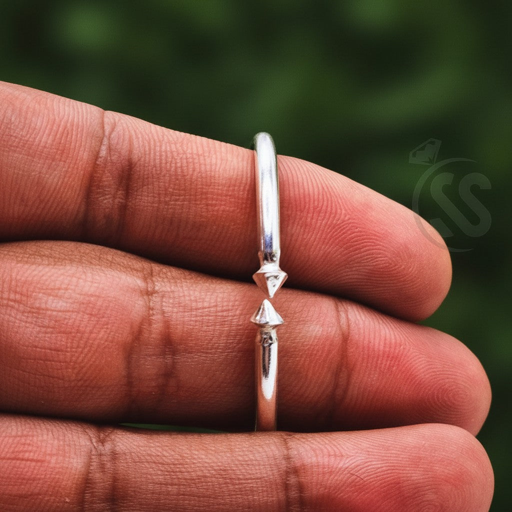 SilverStones.Pk handmade pure silver wrist band for kids, featuring a simple elegant design with two small pointed accents.