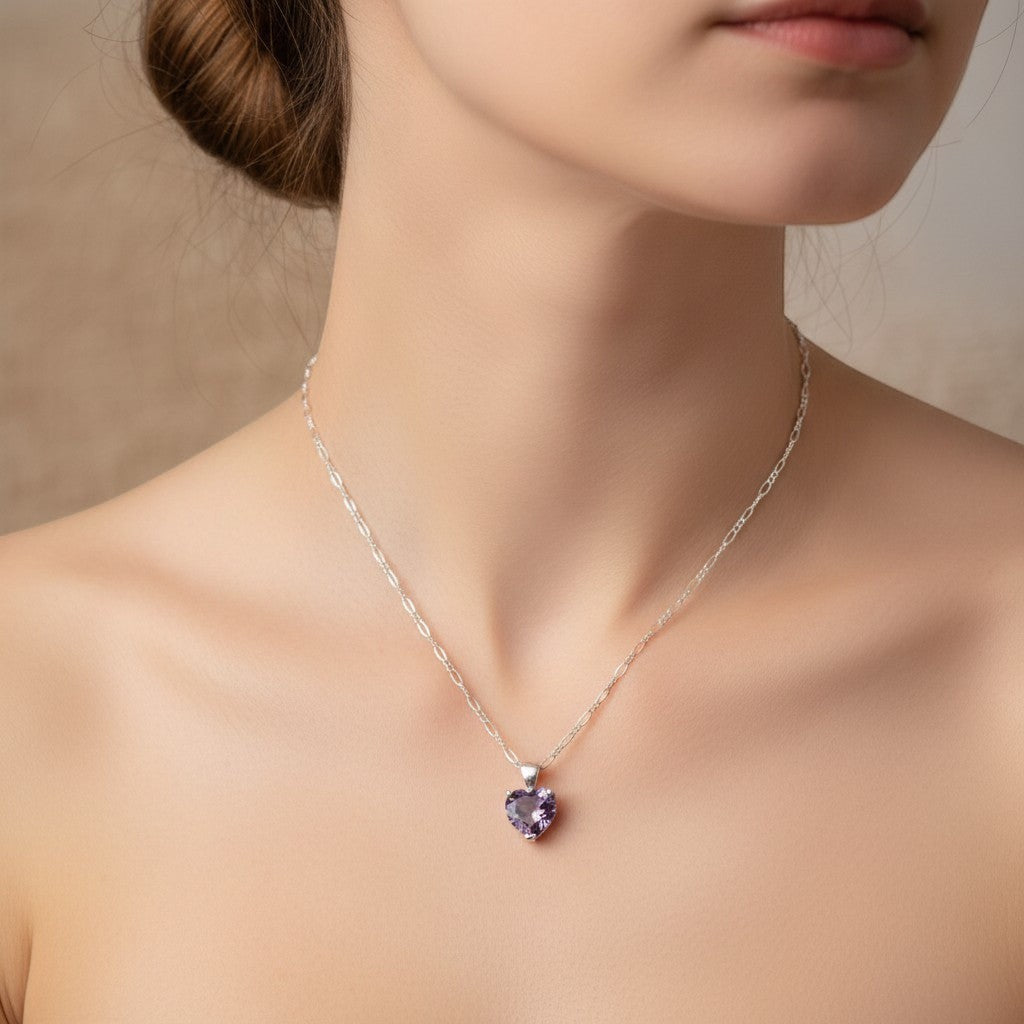 SilverStones.Pk sterling silver necklace with a heart-shaped purple amethyst pendant and figaro chain.