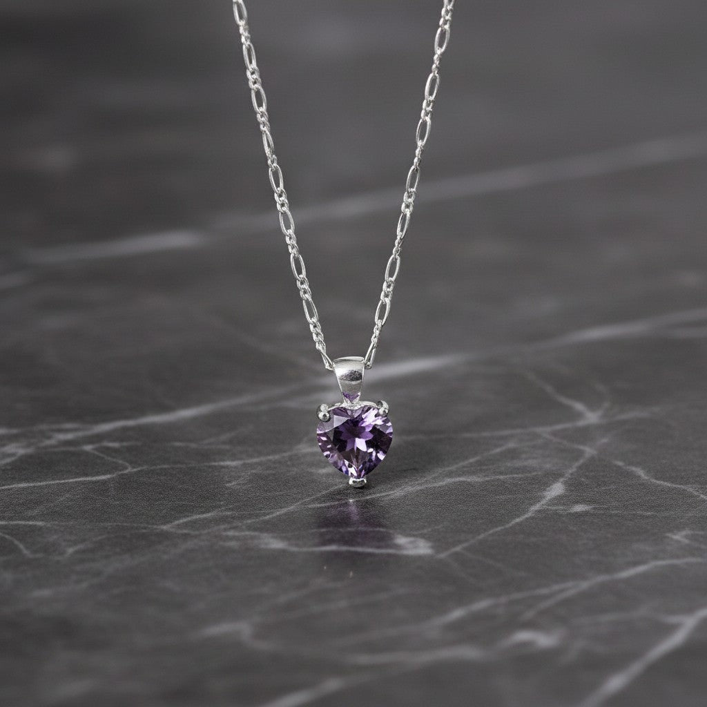 SilverStones.Pk heart-shaped amethyst pendant necklace with a delicate figaro chain, symbolizing love and tranquility.