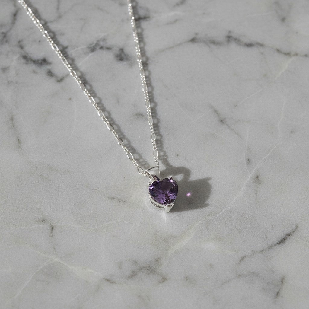 SilverStones.Pk heart-shaped amethyst pendant necklace with a delicate figaro chain, symbolizing love and tranquility.