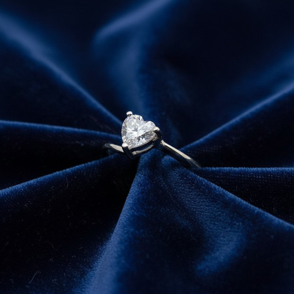 SilverStones.Pk ladies' 1 carat heart-shaped moissanite diamond ring in silver, presented on white satin.