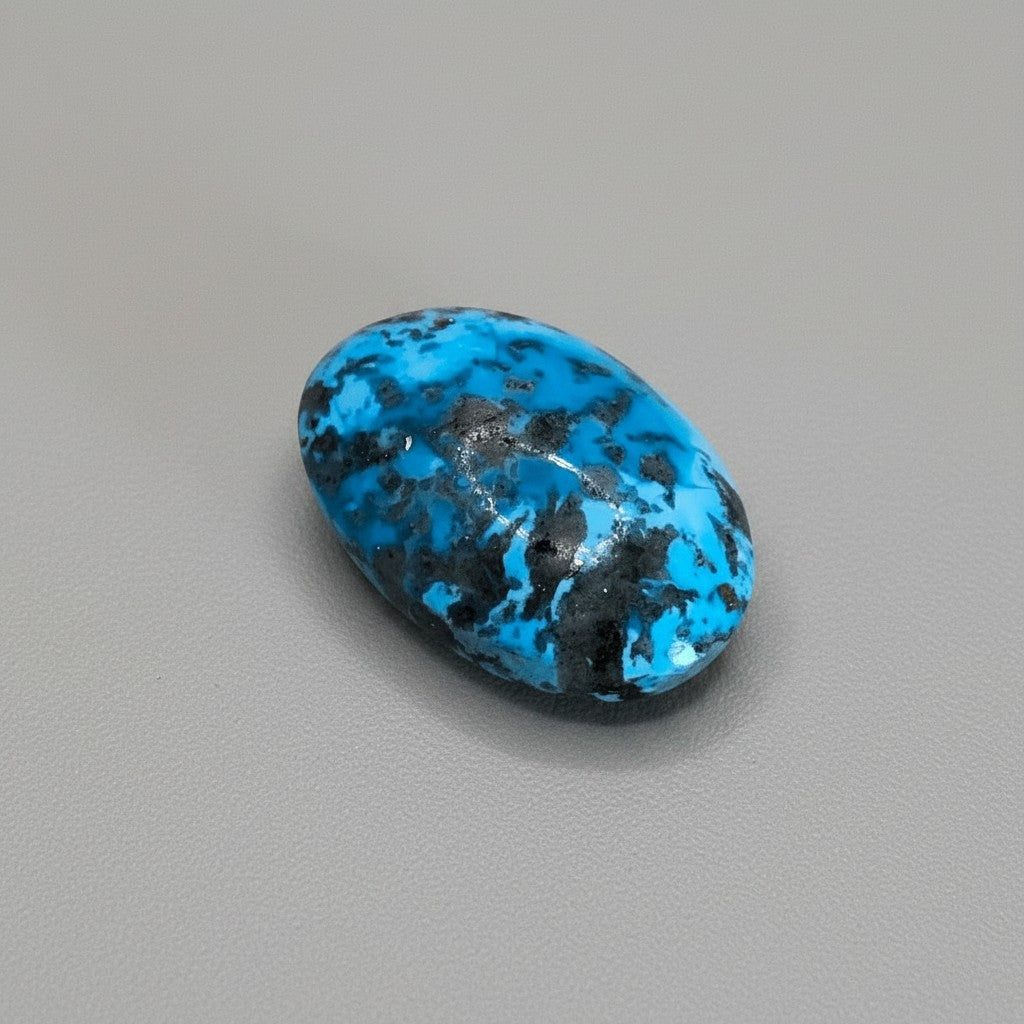 SilverStones.Pk oval-shaped Shajri Irani Feroza (Turquoise) gemstone with black veining, 35 carats.