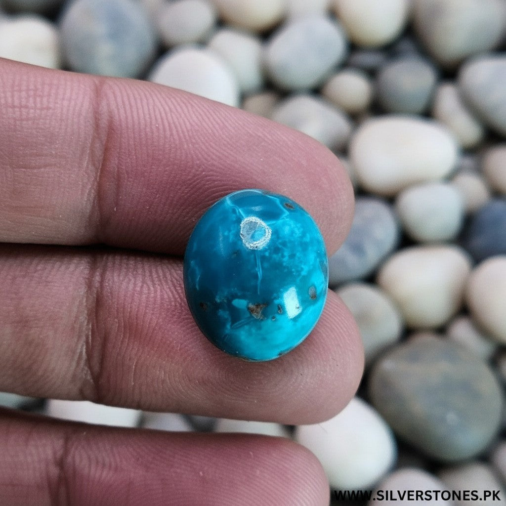 SilverStones.Pk oval-cut Shajri Irani Feroza (Turquoise) gemstone, 19.65 carat, with natural veining and antique charm.