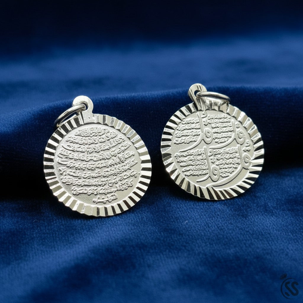 SilverStones.Pk Islamic pendant with Arabic calligraphy of 4 Quls and Ayat Ul Kursi on both sides. Round, double-sided, silver metal.