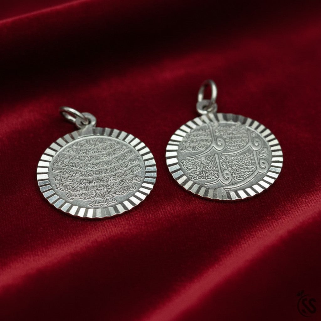SilverStones.Pk Islamic silver pendant featuring Arabic calligraphy of 4 Quls and Ayat Ul Kursi on both sides, with a fluted edge.