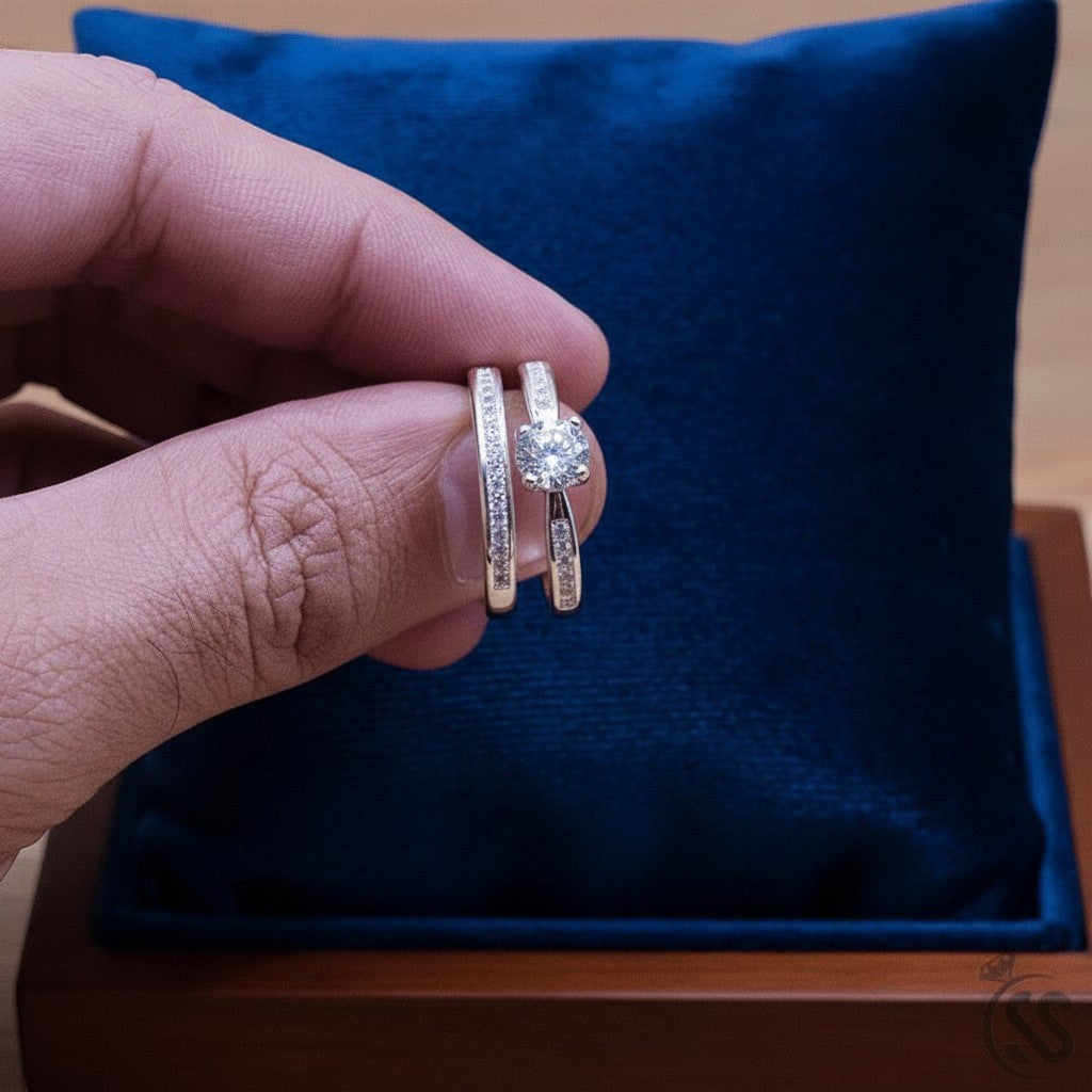 SilverStones.Pk pair of Italian 925 sterling silver ladies rings with white zircons. One ring has a central stone, the other is a band with smaller stones.