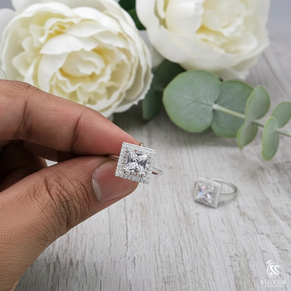 SilverStones.Pk Italian 925 sterling silver ring with a square-cut clear zircon center stone surrounded by smaller stones.
