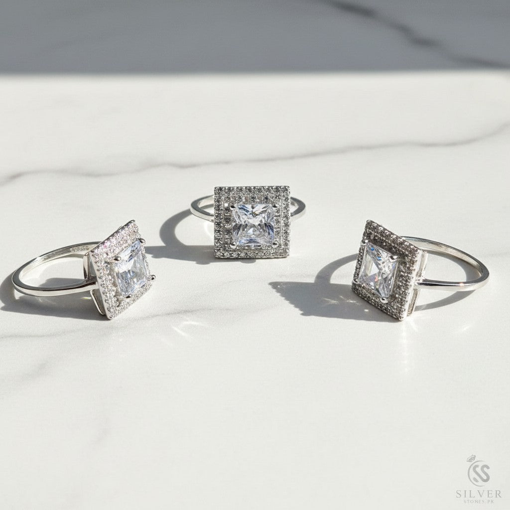 SilverStones.Pk Italian 925 sterling silver ring with a large square-cut clear zircon center stone surrounded by smaller stones.