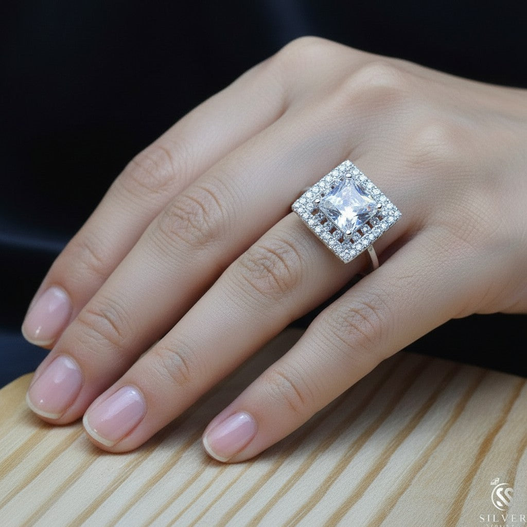 SilverStones.Pk Italian 925 sterling silver ring with a large square-cut clear zircon center stone surrounded by smaller stones.