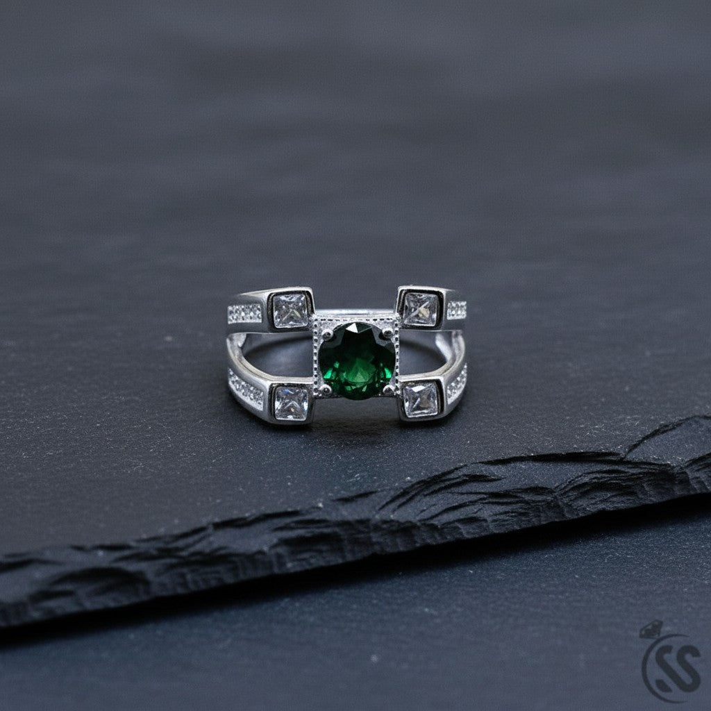 SilverStones.Pk Italian 925 sterling silver men's ring with a central green oval stone and clear square accent stones.