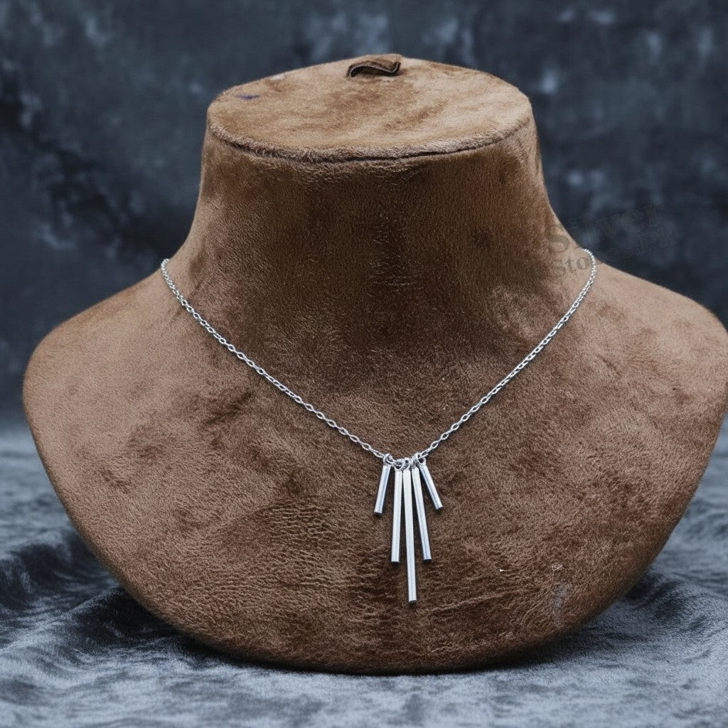 SilverStones.Pk sterling silver necklace with a pendant of five vertical bars of varying lengths.