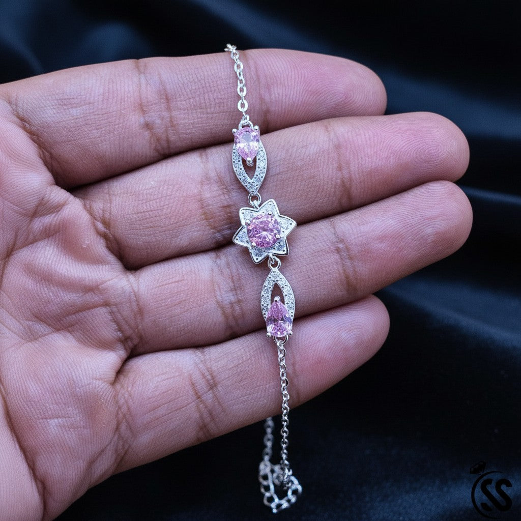 SilverStones.Pk 925 Italian silver bracelet with pink zircon stones and a star design. Features a delicate chain and secure clasp.