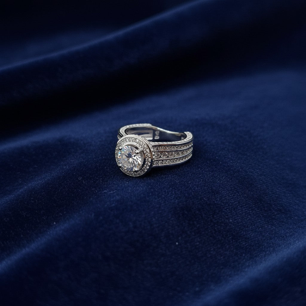 SilverStones.Pk 925 Italian silver ring with a 1 carat round moissanite diamond center stone surrounded by micro zircon accents.