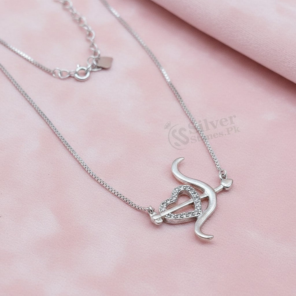 SilverStones.Pk sterling silver necklace with a vintage-inspired pendant featuring a heart pierced by an arrow, adorned with zircon stones.