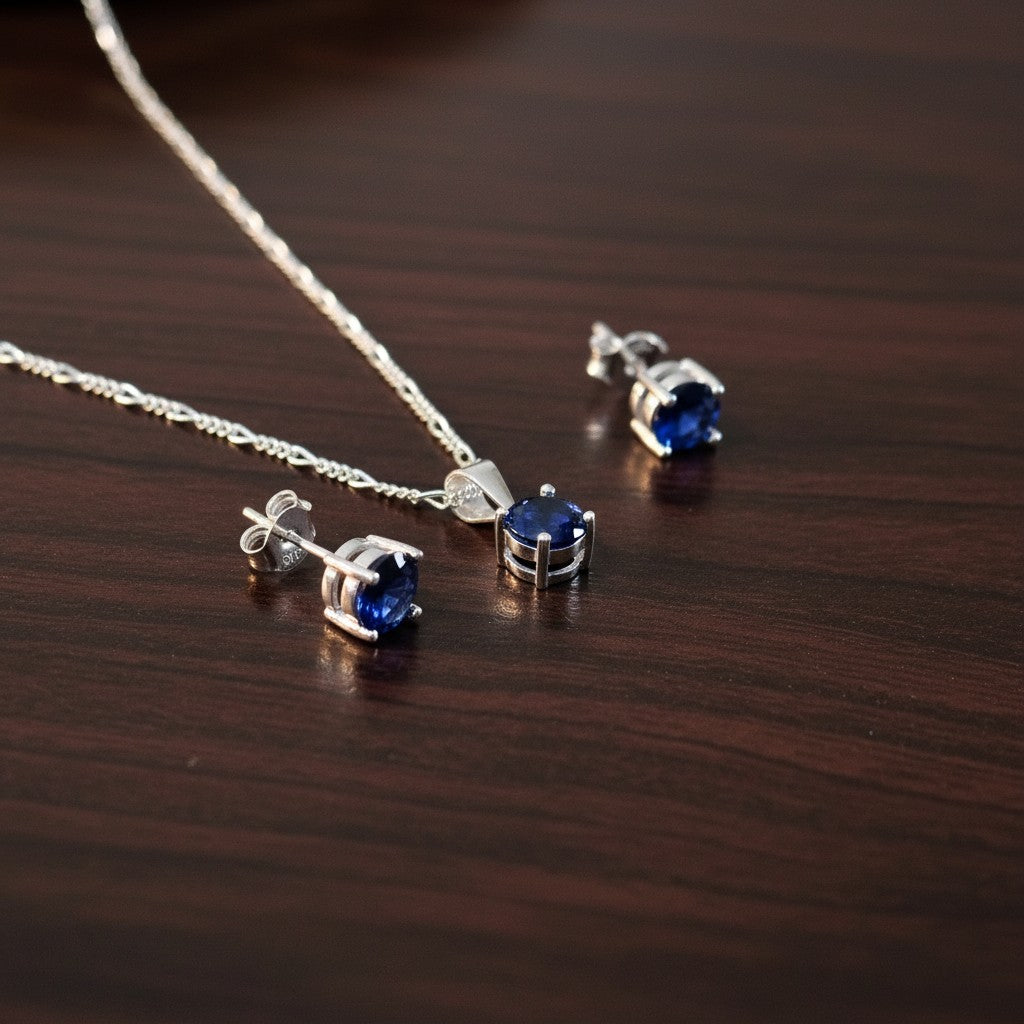 SilverStones.Pk Italian 925 sterling silver pendant and matching earrings with oval deep blue zircon stones.