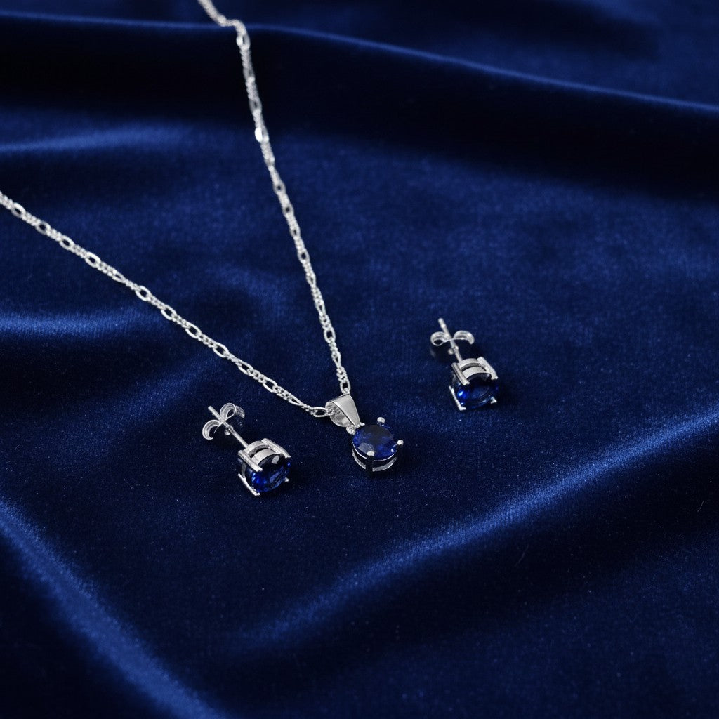 SilverStones.Pk Italian 925 sterling silver pendant necklace and stud earrings set with oval blue zircon stones.