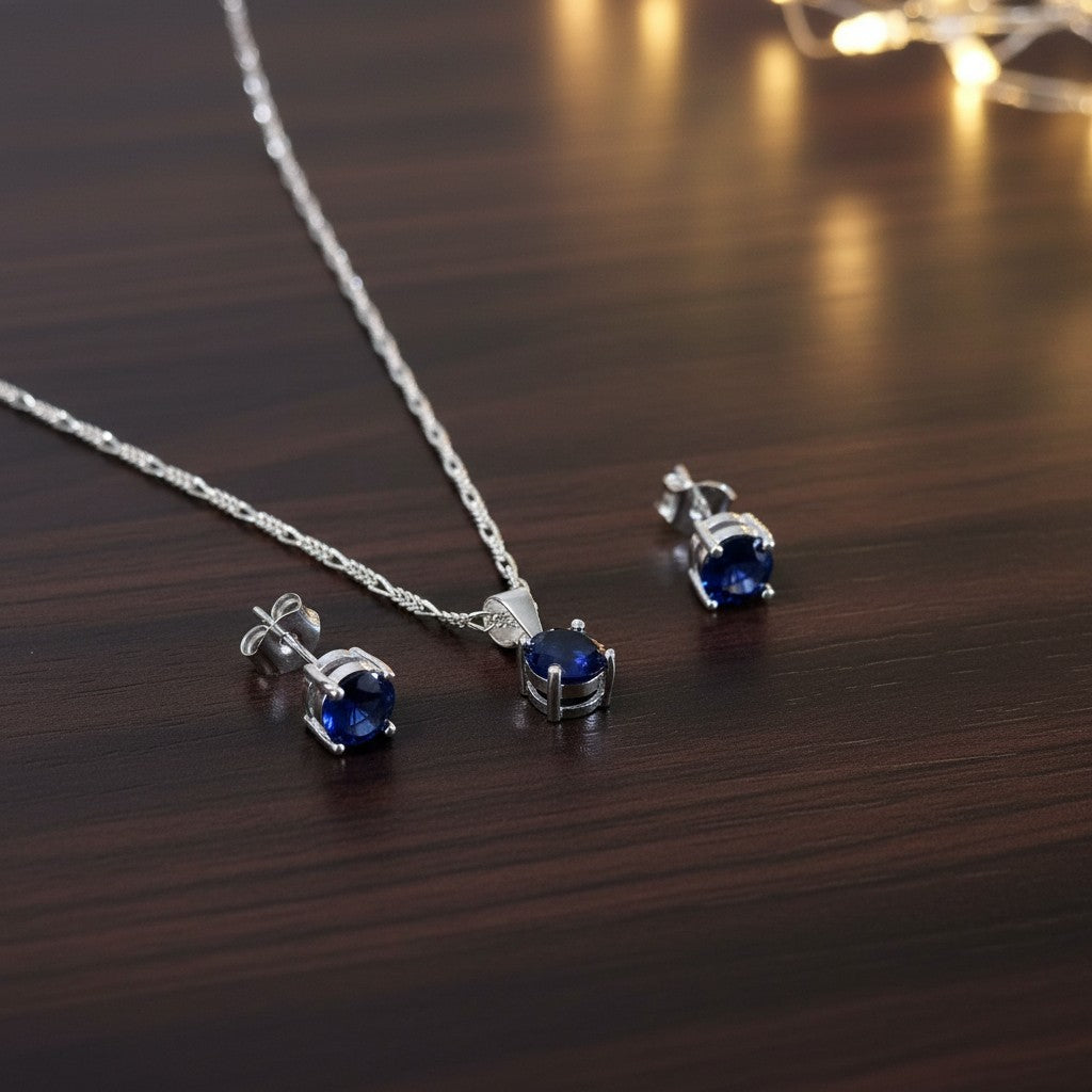 SilverStones.Pk Italian 925 sterling silver pendant and stud earrings set with oval blue zircon stones.