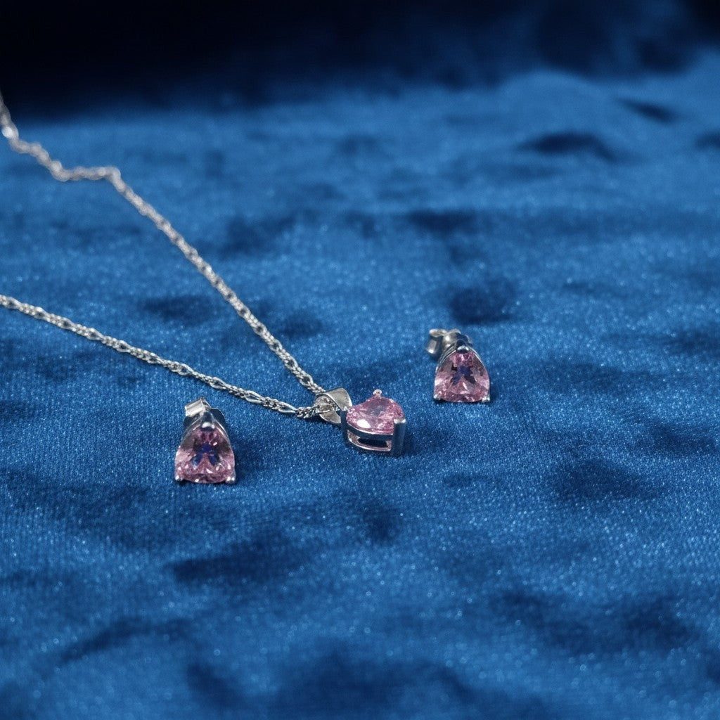 SilverStones.Pk Italian 925 sterling silver pendant and earrings set with pink heart-shaped zircon stones.