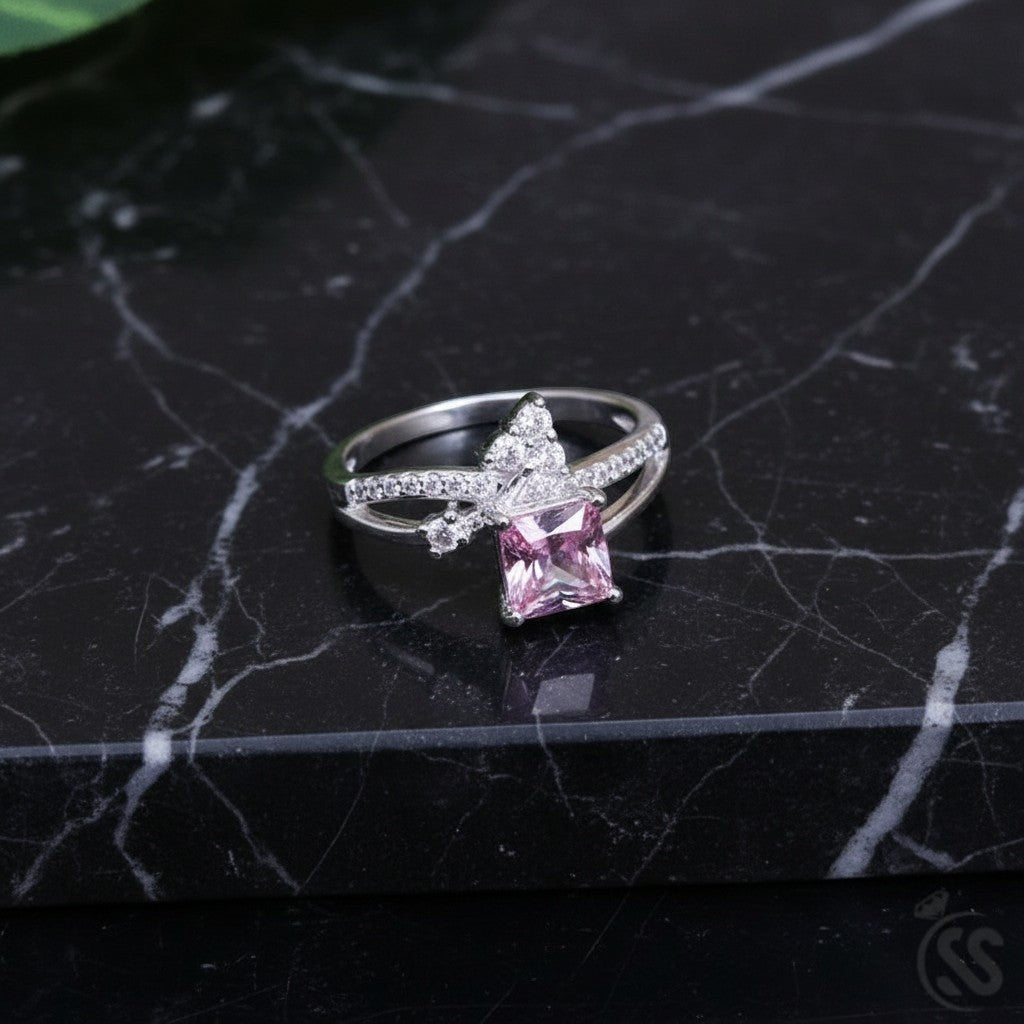 SilverStones.Pk 925 Italian silver ring with princess-cut pink zircon and smaller clear zircons.