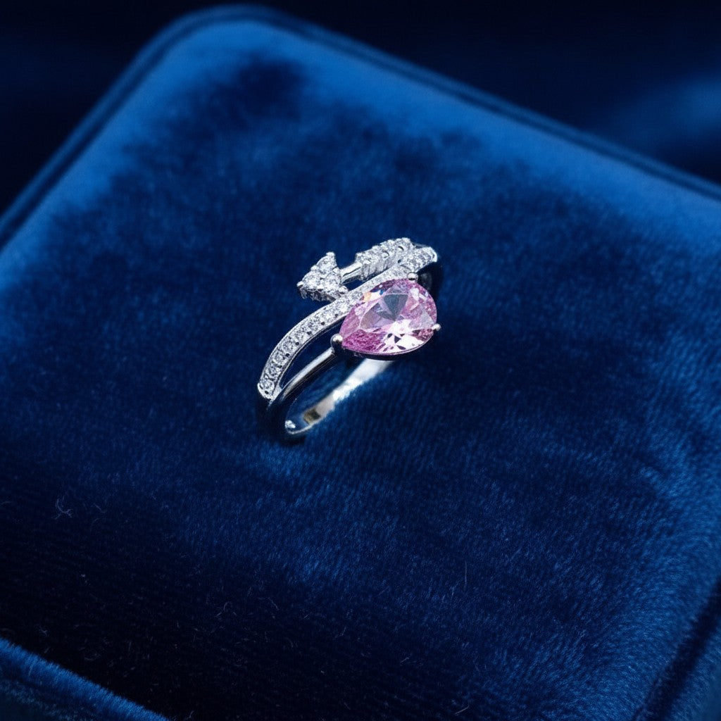 SilverStones.Pk 925 Italian sterling silver ring with a pear-cut pink zircon and clear zircon accents.