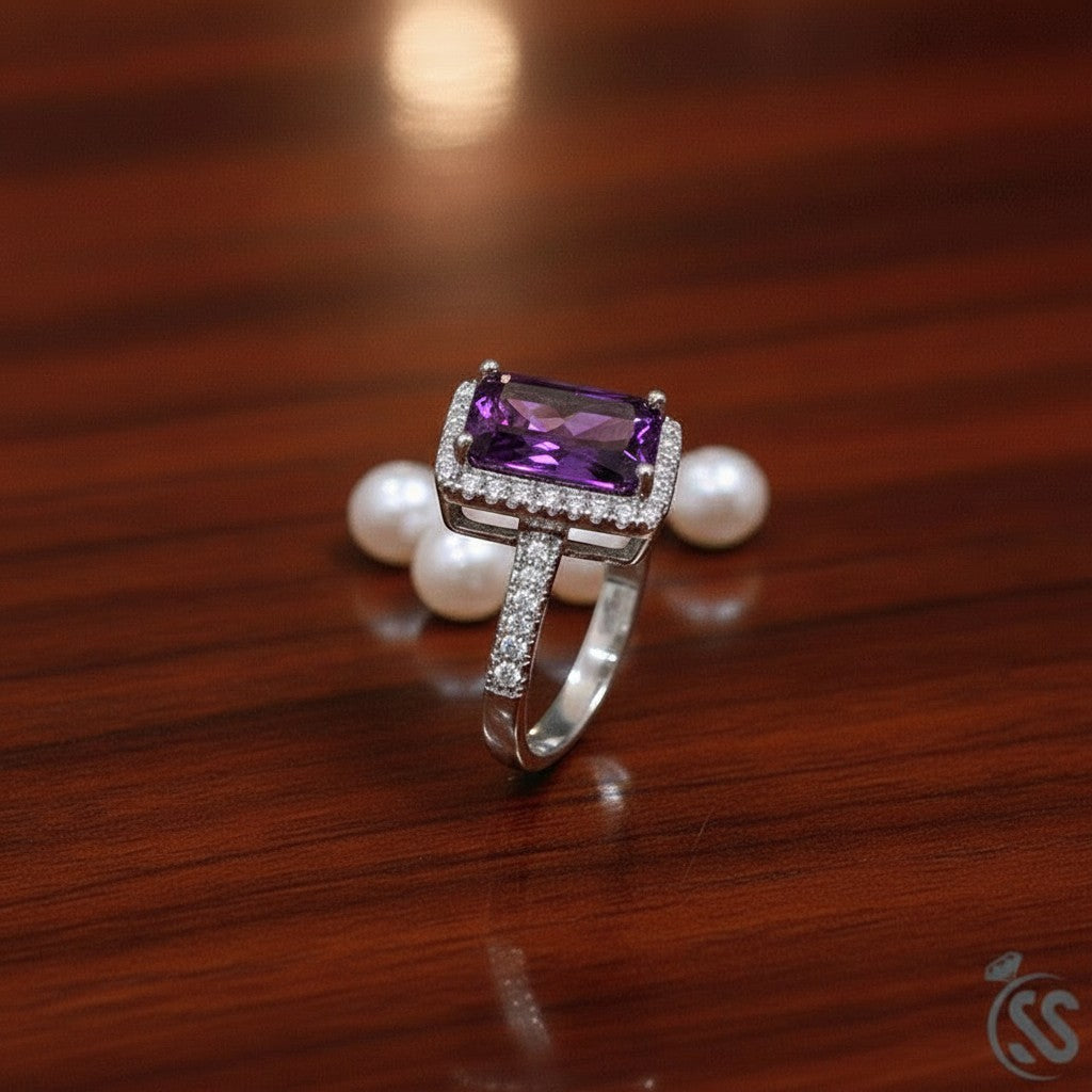 SilverStones.Pk 925 Italian silver ring with a large rectangular purple zircon surrounded by smaller clear zircons. Band is also set with small clear zircons.