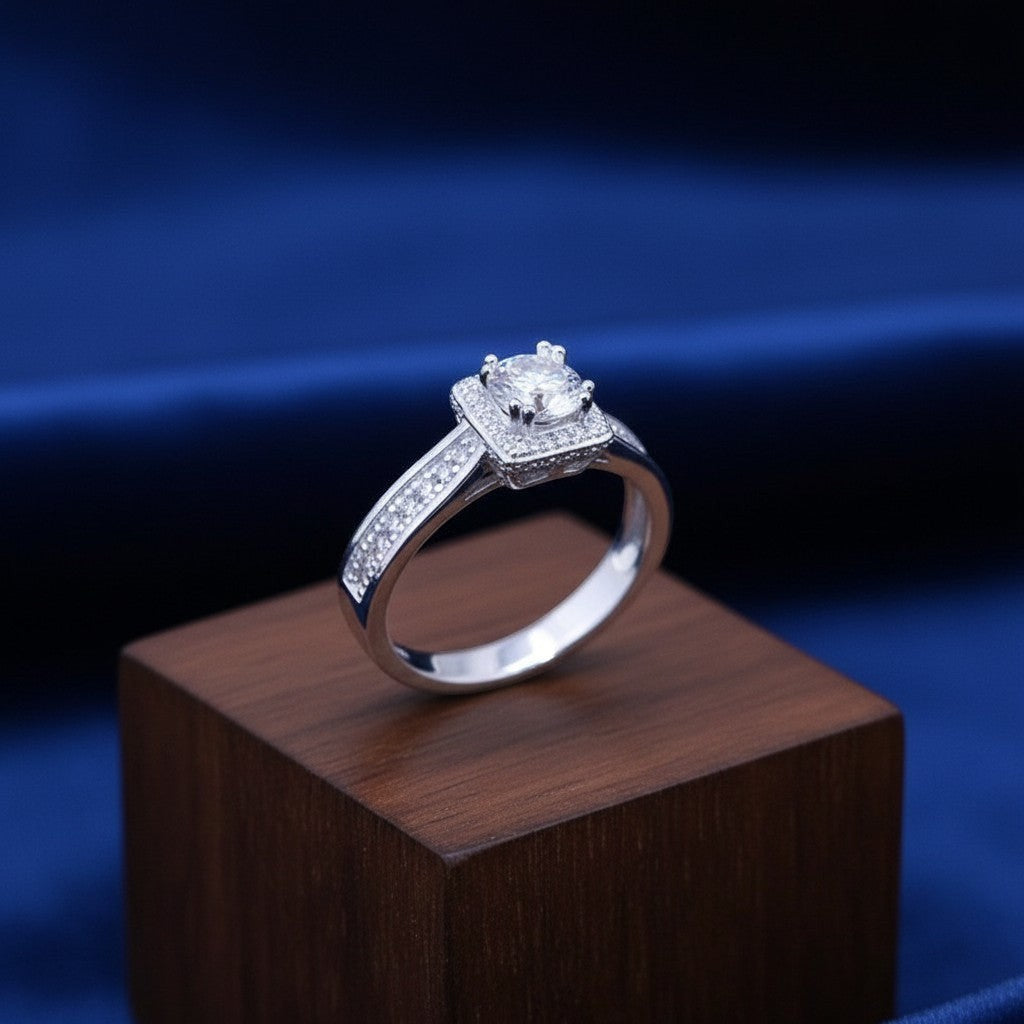 SilverStones.Pk 925 Italian sterling silver ladies ring with square halo and channel-set zircons on band.