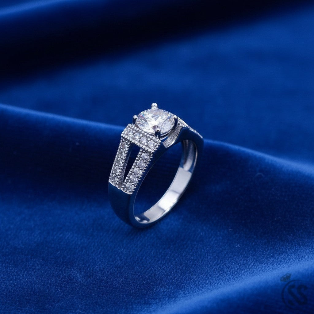 SilverStones.Pk 925 Italian sterling silver ladies ring with a central round zircon and channel-set side stones.