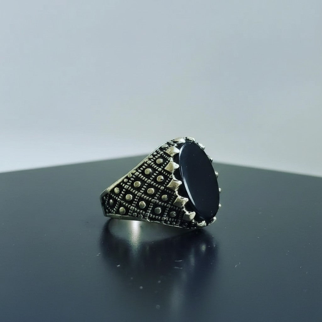 SilverStones.Pk men's silver ring with oval black Aqeeq stone and intricate detailing.