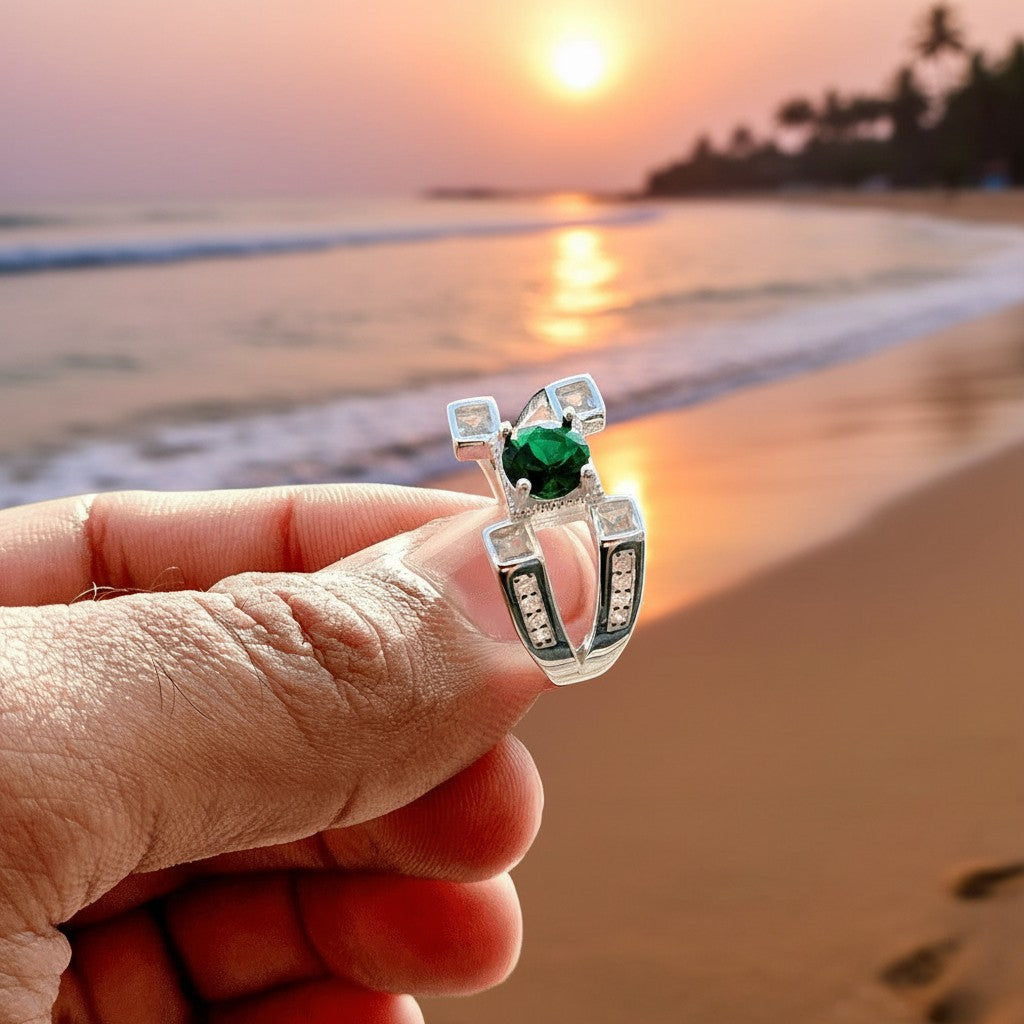 SilverStones.Pk men's sterling silver ring with green emerald and clear accent stones, classic masculine design.