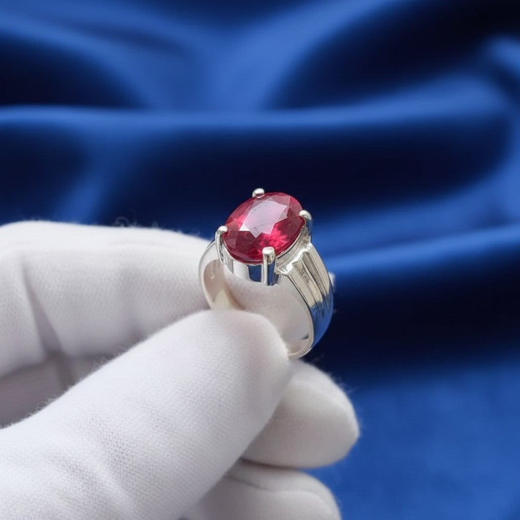 SilverStones.Pk men's silver ring with a large oval, deep red ruby stone. Masculine design.