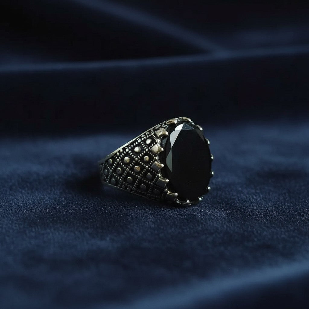SilverStones.Pk men's silver ring with a large oval black Aqeeq stone and intricate patterned band.