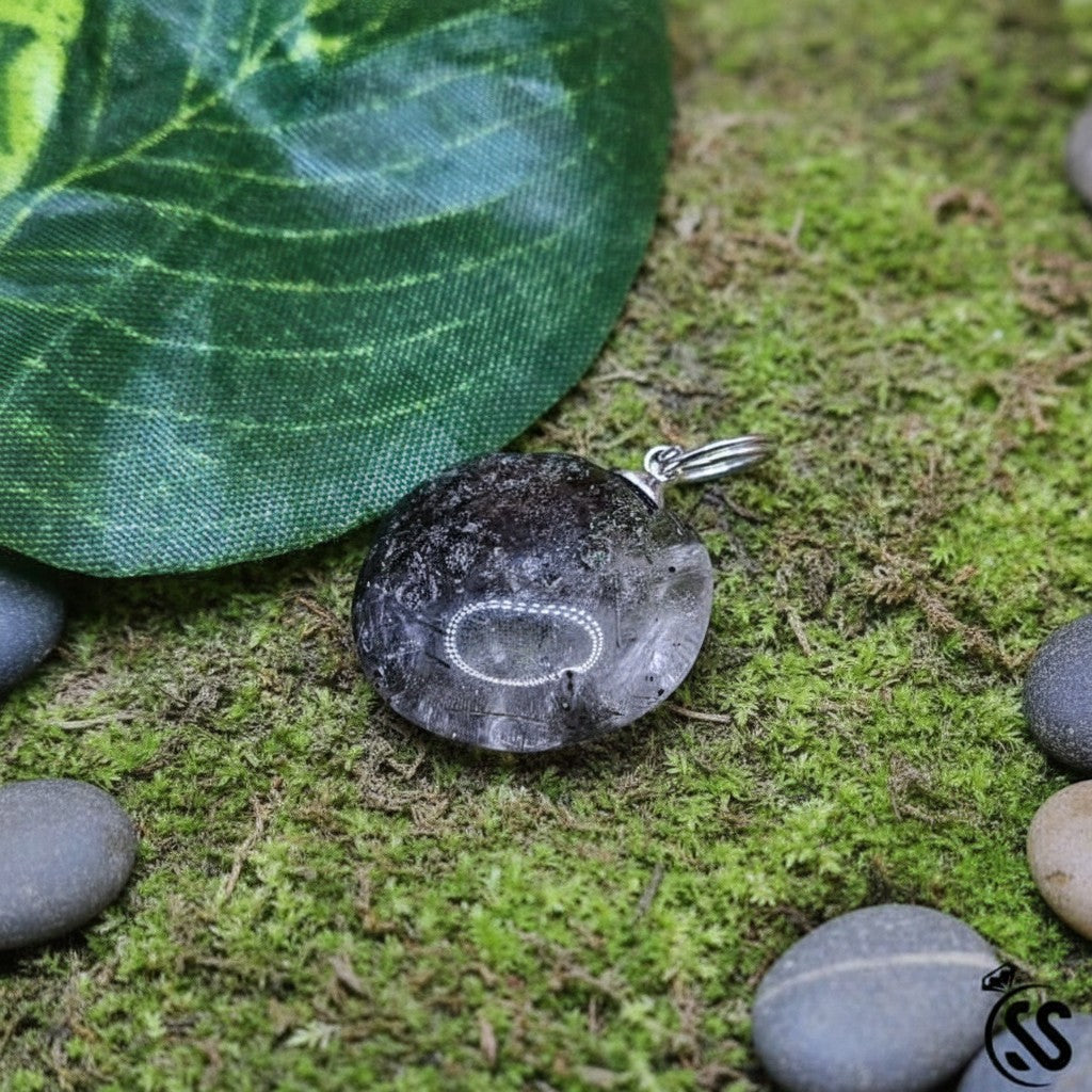 SilverStones.Pk natural Muh-e-Najaf quartz pendant with dark inclusions and a silver metal hook. Unisex spiritual jewelry.
