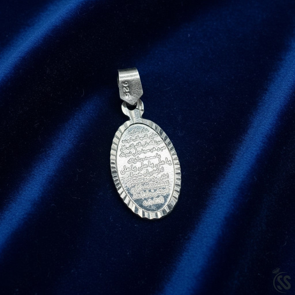 SilverStones.Pk oval silver pendant with engraved Nad-e-Ali prayer and textured border.