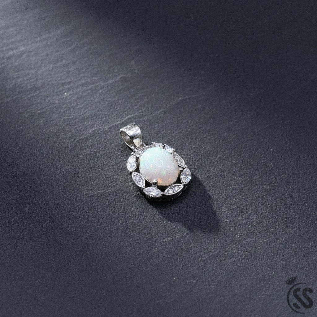 SilverStones.Pk oval Ethiopian opal pendant surrounded by clear cubic zirconia stones, set in rhodium-plated sterling silver.