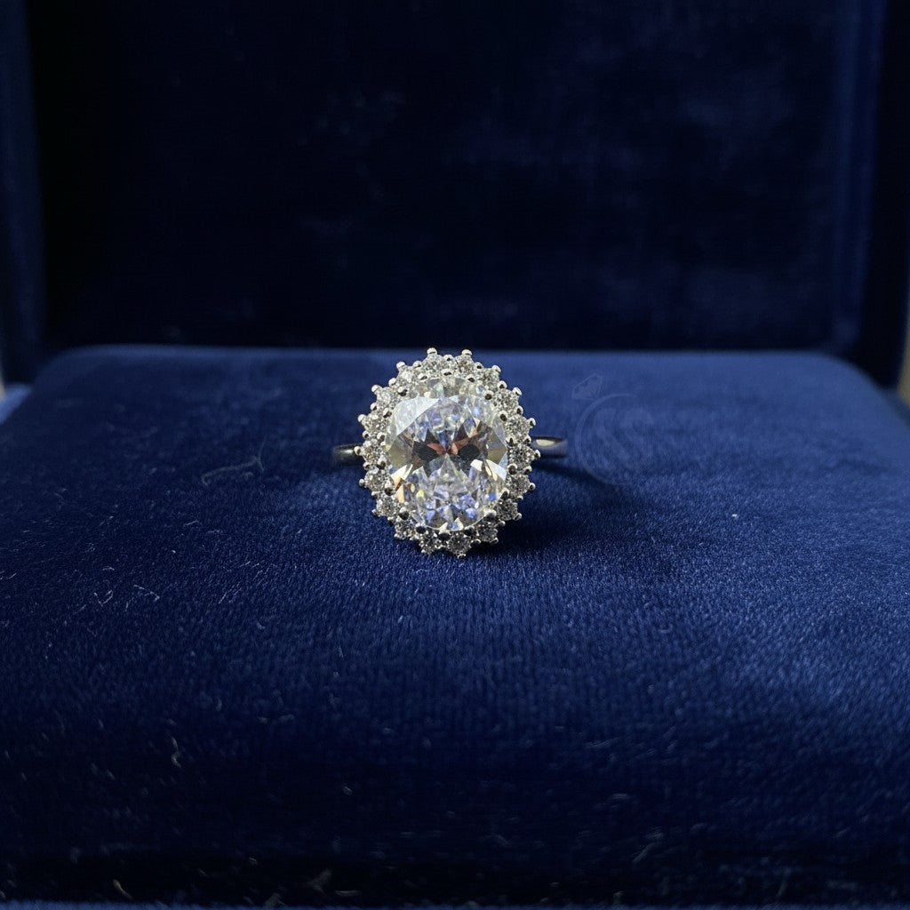 SilverStones.Pk oval zircon halo ring in 925 Italian sterling silver. Features a large central zircon surrounded by smaller stones.